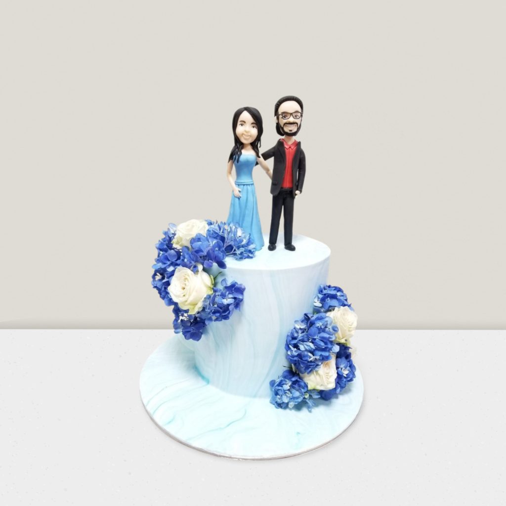 Young_Couple_Cake_with_Blue_Flowers
